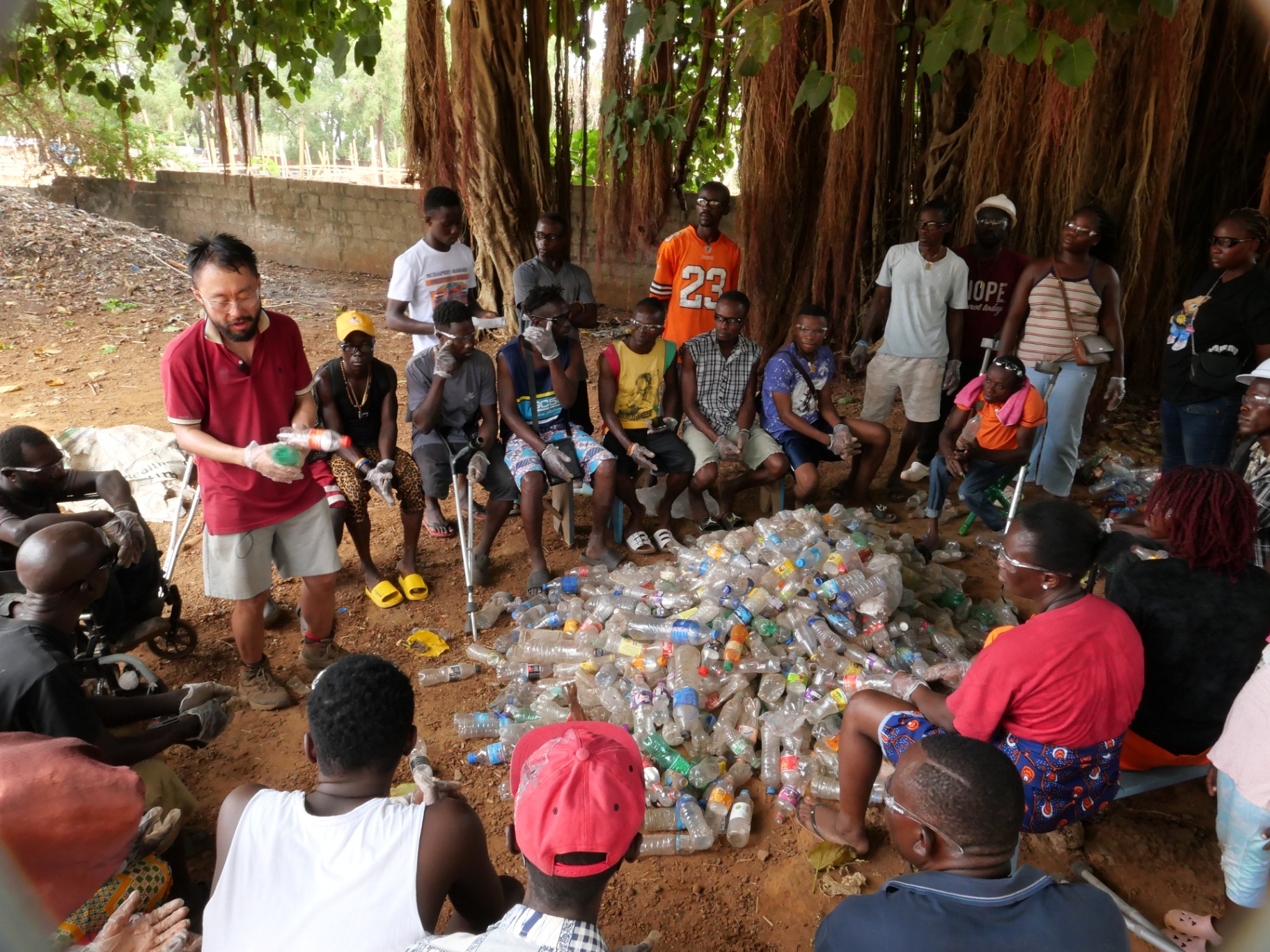 Dr. Ye Tao leading a community workshop training session with local residents in Sierra Leone