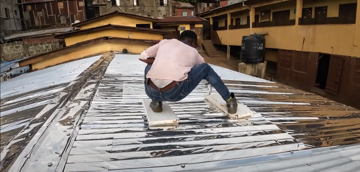 Installing a reflective school roof